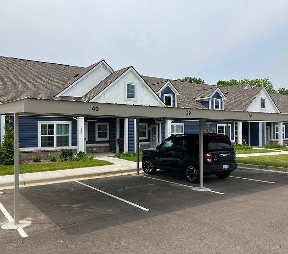 Black bronco parked in carport